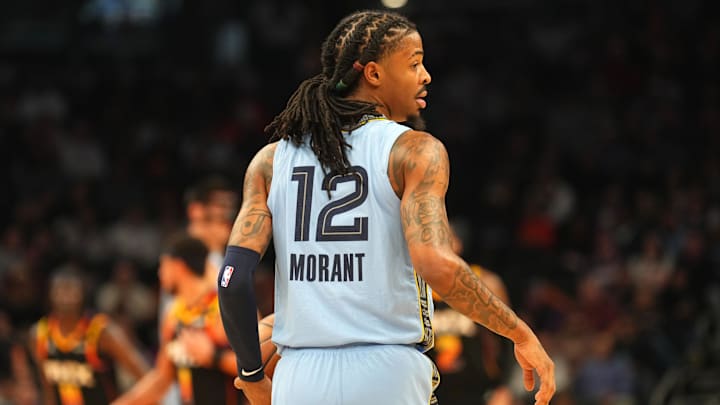 Feb 11, 2025; Phoenix, Arizona, USA; Memphis Grizzlies guard Ja Morant (12) dribbles against the Phoenix Suns during the first half at Footprint Center. Mandatory Credit: Joe Camporeale-Imagn Images