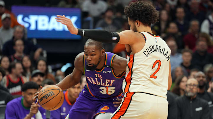 Dec 21, 2024; Phoenix, Arizona, USA; Phoenix Suns forward Kevin Durant (35) drives against Detroit Pistons guard Cade Cunningham (2) during the first half at Footprint Center. Mandatory Credit: Joe Camporeale-Imagn Images Dec 21, 2024; Phoenix, Arizona, USA; Phoenix Suns forward Kevin Durant (35) drives against Detroit Pistons guard Cade Cunningham (2) during the first half at Footprint Center. Mandatory Credit: Joe Camporeale-Imagn Images