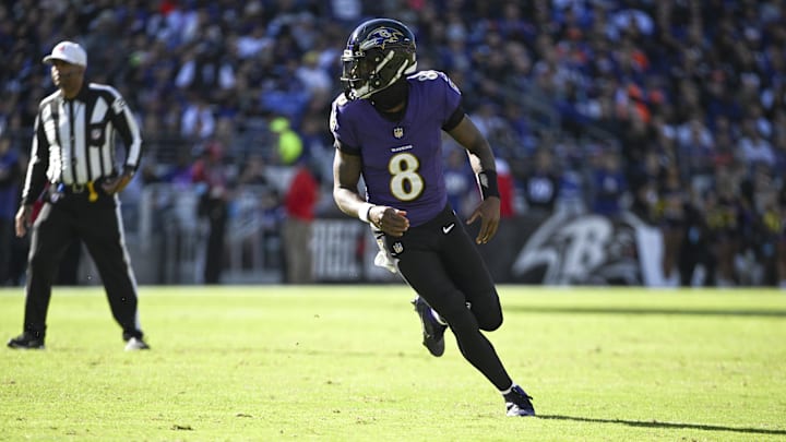 Nov 3, 2024; Baltimore, Maryland, USA;  Baltimore Ravens quarterback Lamar Jackson (8) after a hand off during the first quarter against the Denver Broncos at M&T Bank Stadium. Mandatory Credit: Tommy Gilligan-Imagn Images