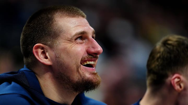 Jan 1, 2025; Denver, Colorado, USA; Denver Nuggets center Nikola Jokic (15) reacts from the bench in the fourth quarter against the Denver Nuggets at Ball Arena. Mandatory Credit: Ron Chenoy-Imagn Images