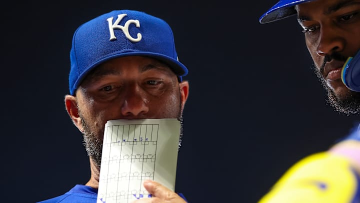 Royals hitting coach Alex Zumwalt goes over strategy with Maikel Garcia during a game against the Minnesota Twins. Royals hitting coach Alex Zumwalt goes over strategy with Maikel Garcia during a game against the Minnesota Twins.