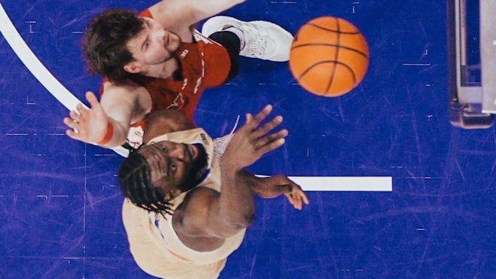 Franck Kepnang tries to bank one in for the Huskies. Franck Kepnang tries to bank one in for the Huskies.