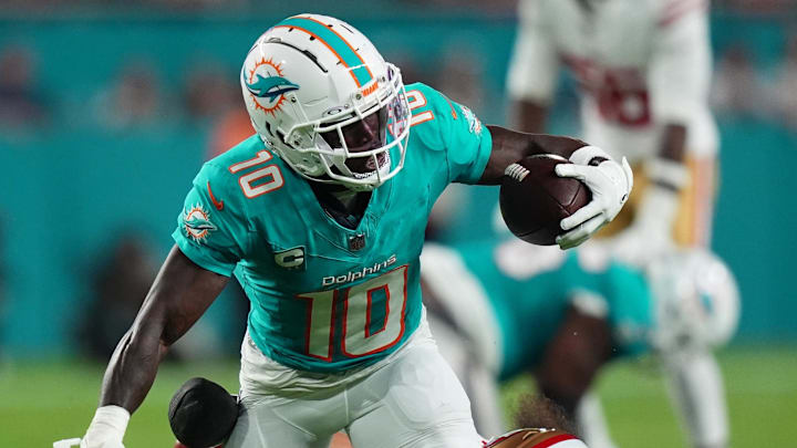 San Francisco 49ers safety Talanoa Hufanga (29) tackles Miami Dolphins wide receiver Tyreek Hill (10) during second half at Hard Rock Stadium.