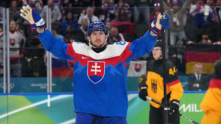 Feb 18, 2026; Milan, Italy; Pavol Regenda of Slovakia celebrates scoring their fifth goal in a men's ice hockey quarterfinal during the Milano Cortina 2026 Olympic Winter Games at Milano Santagiulia Ice Hockey Arena. Mandatory Credit: James Lang-Imagn Images Feb 18, 2026; Milan, Italy; Pavol Regenda of Slovakia celebrates scoring their fifth goal in a men's ice hockey quarterfinal during the Milano Cortina 2026 Olympic Winter Games at Milano Santagiulia Ice Hockey Arena. Mandatory Credit: James Lang-Imagn Images