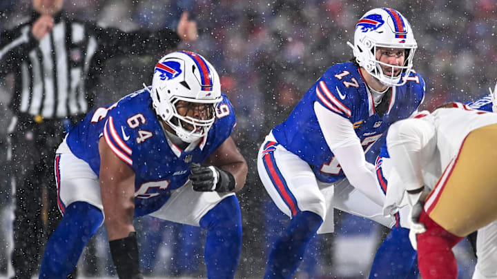 Buffalo Bills quarterback Josh Allen (17) and guard O'Cyrus Torrence (64) at the line of scrimmage against the San Francisco 49ers in the second quarter at Highmark Stadium.