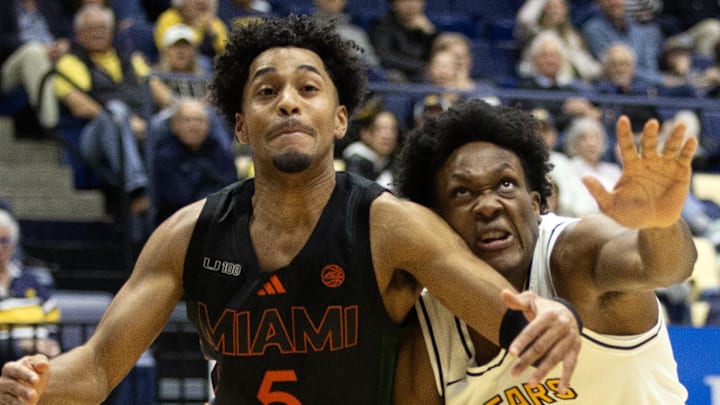 Jan 25, 2025; Berkeley, California, USA; Miami Hurricanes guard Jalen Blackmon (5) and California Golden Bears guard Joshua Ola-Joseph (1) pursue a loose ball during the first half at Haas Pavilion. Mandatory Credit: D. Ross Cameron-Imagn Images Jan 25, 2025; Berkeley, California, USA; Miami Hurricanes guard Jalen Blackmon (5) and California Golden Bears guard Joshua Ola-Joseph (1) pursue a loose ball during the first half at Haas Pavilion. Mandatory Credit: D. Ross Cameron-Imagn Images
