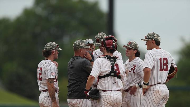 Alabama baseball players meet with associate head coach Jason Jackson.