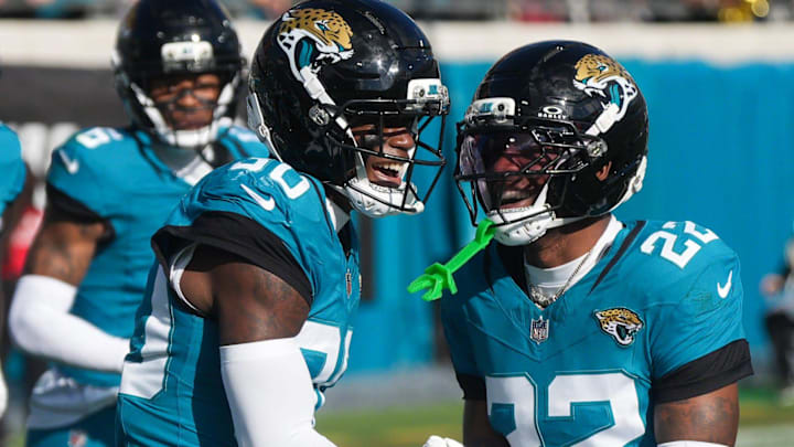 Jacksonville Jaguars cornerback Montaric Brown (30) celebrates his interception in the second quarter with Jacksonville Jaguars cornerback Jarrian Jones (22) during an NFL football game at EverBank Stadium, Sunday, Dec. 14, 2025, in Jacksonville, Fla. [Doug Engle/Florida Times-Union]