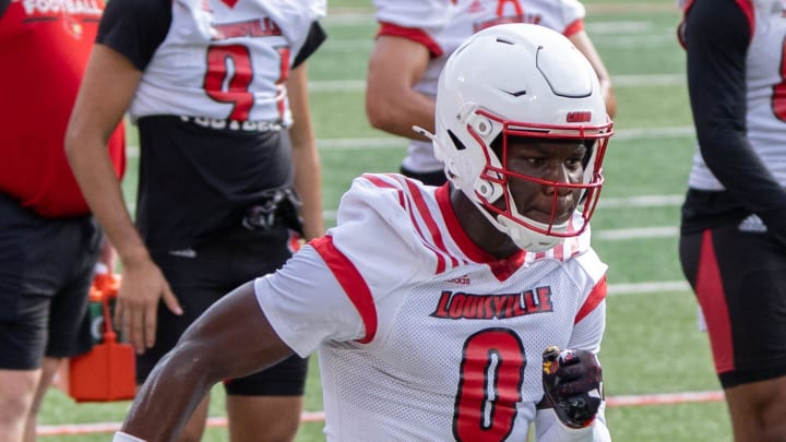 Louisville wide receiver Chris Bell (0) runs a drill during practice.