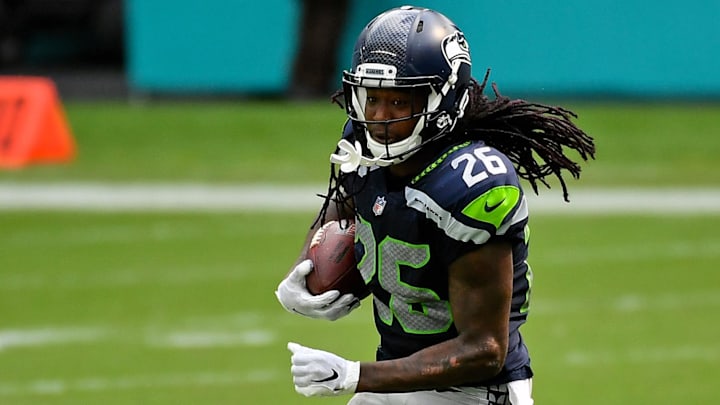 Oct 4, 2020; Miami Gardens, Florida, USA; Seattle Seahawks cornerback Shaquill Griffin (26) runs the ball after intercepting the pass from Miami Dolphins quarterback Ryan Fitzpatrick (14, not pictured) during the second half at Hard Rock Stadium.