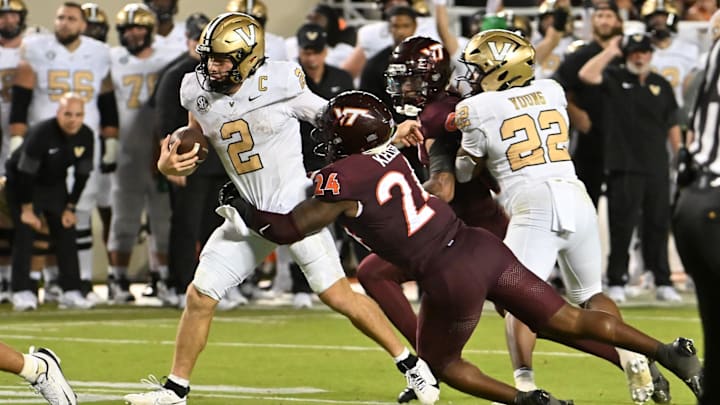 Sep 6, 2025; Blacksburg, Virginia, USA; Virginia Tech Hokies linebacker Jaden Keller (24) tackles Vanderbilt Commodores quarterback Diego Pavia (2) during the fourth quarter at Lane Stadium. Mandatory Credit: Brian Bishop-Imagn Images Sep 6, 2025; Blacksburg, Virginia, USA; Virginia Tech Hokies linebacker Jaden Keller (24) tackles Vanderbilt Commodores quarterback Diego Pavia (2) during the fourth quarter at Lane Stadium. Mandatory Credit: Brian Bishop-Imagn Images