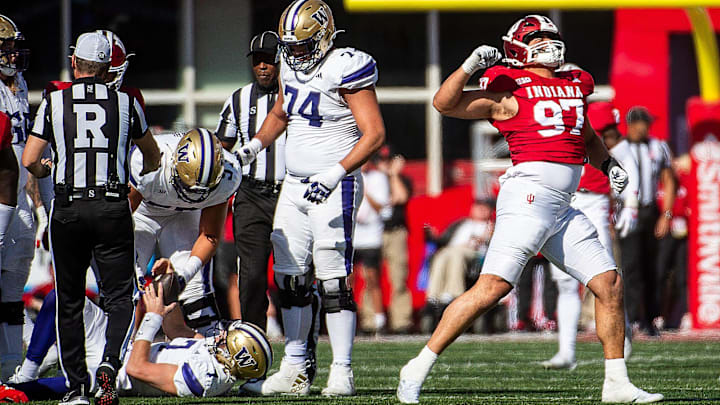 Indiana's Mario Landino (97) celebrates a sack of Washington's Will Rogers (7) while right tackle Drew Azzopardi (74) looks on. 