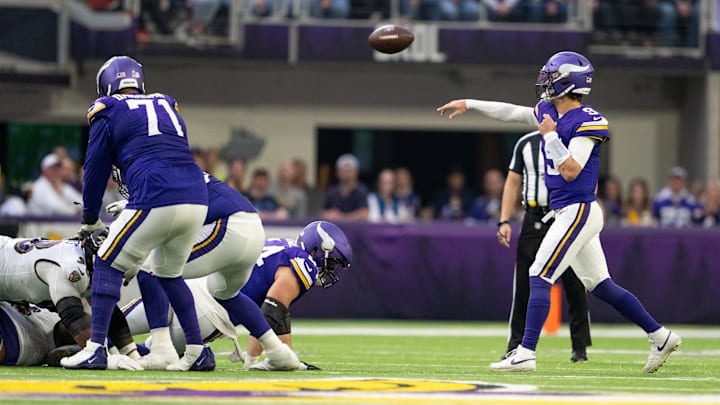 Vikings left tackle Christian Darrisaw (71) blocking for quarterback J.J. McCarthy (9). Vikings left tackle Christian Darrisaw (71) blocking for quarterback J.J. McCarthy (9).