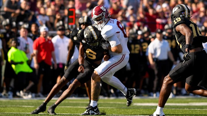 Oct 5, 2024; Nashville, Tennessee, USA;  Vanderbilt Commodores cornerback Kolbey Taylor (6) hits Alabama Crimson Tide tight end Josh Cuevas (80) after a made catch during the first half at FirstBank Stadium. Mandatory Credit: Steve Roberts-Imagn Images