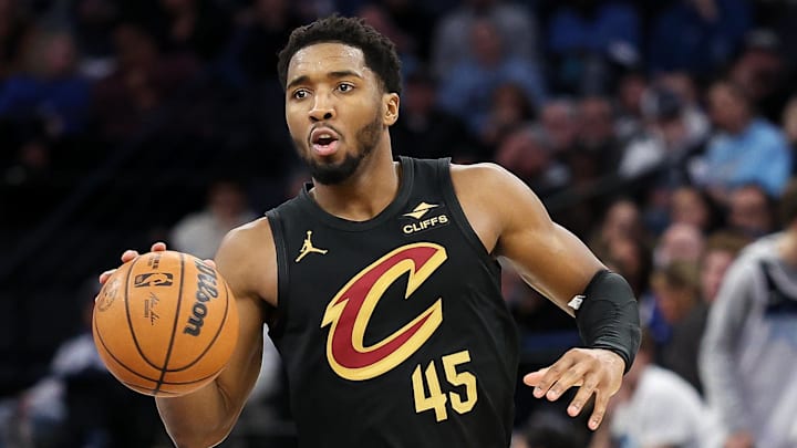 Jan 18, 2025; Minneapolis, Minnesota, USA; Cleveland Cavaliers guard Donovan Mitchell (45) dribbles the ball during the fourth quarter against the Minnesota Timberwolves at Target Center. 