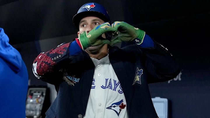 Toronto Blue Jays designated hitter George Springer (4) celebrates after hitting a three-run home run in the seventh inning against the Seattle Mariners during game seven of the ALCS round for the 2025 MLB playoffs at Rogers Centre.