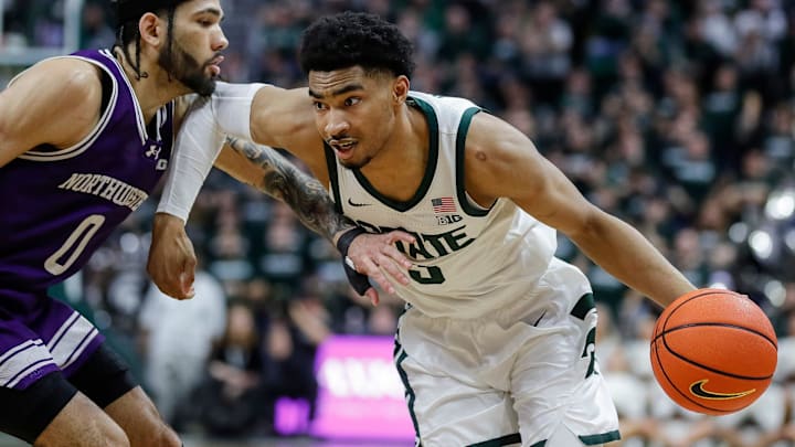 Michigan State guard Jaden Akins (3) dribbles against Northwestern guard Boo Buie (0) during the