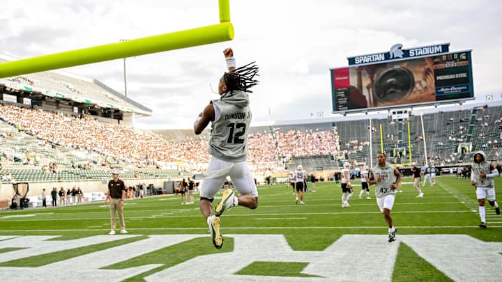 Michigan State's Justin Denson Jr. jumps up to touch the goal post before the football game against Western Michigan on Friday, Aug. 29, 2025, in East Lansing. Michigan State's Justin Denson Jr. jumps up to touch the goal post before the football game against Western Michigan on Friday, Aug. 29, 2025, in East Lansing.