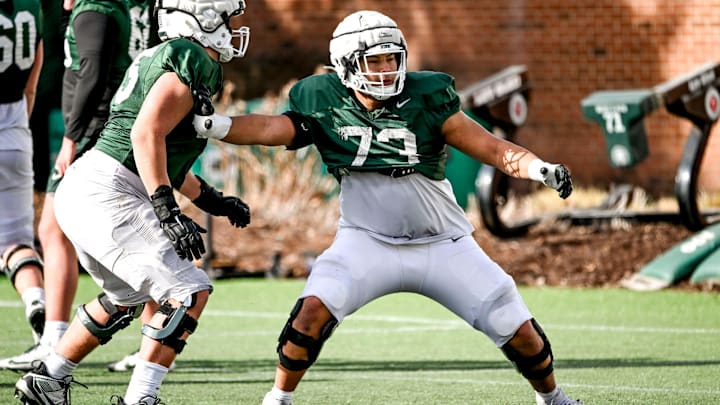 Michigan State offensive lineman Rustin Young, right, and Stanton Ramil work out during football practice on Tuesday, April 8, 2025, in East Lansing.