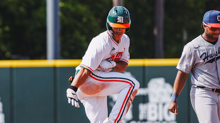 Miami Hurricanes celebrating getting a double against UConn