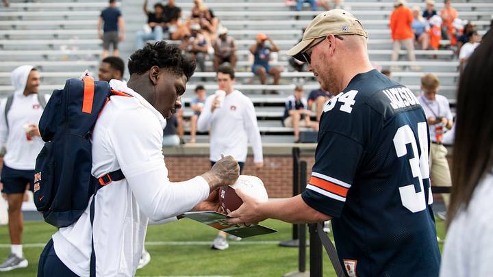 Auburn Tigers linebacker Xavier Atkins (17) signs an autograph after Auburn Tigers A-Day spring game at Jordan-Hare Stadium in Auburn, Ala. on Saturday, April 18, 2026. Auburn Tigers linebacker Xavier Atkins (17) signs an autograph after Auburn Tigers A-Day spring game at Jordan-Hare Stadium in Auburn, Ala. on Saturday, April 18, 2026.