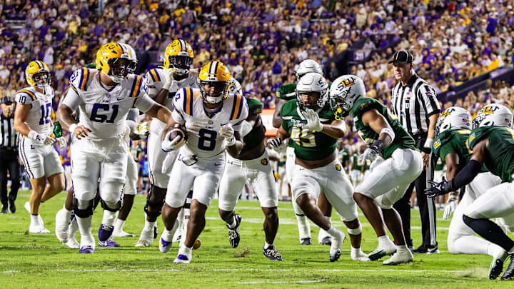 Sep 20, 2025; Baton Rouge, Louisiana, USA;  LSU Tigers quarterback Ju’Juan Johnson (8) runs against the Southeastern Louisiana Lions during the first half at Tiger Stadium. Mandatory Credit: Stephen Lew-Imagn Images