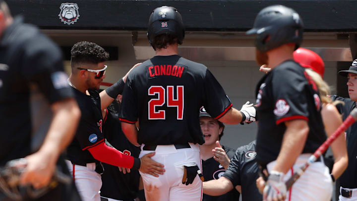Georgia's Charlie Condon (24) celebrates with his teammates after scoring another run during a NCAA Athens Regional baseball game against Army in Athens, Ga., on Friday, May 31, 2024. Georgia won 8-7.