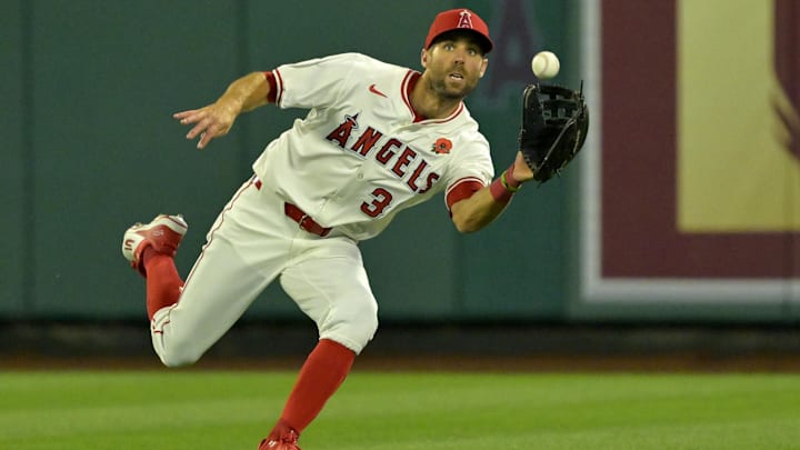 May 26, 2025; Anaheim, California, USA;  Los Angeles Angels center fielder Chris Taylor (33) makes a running catch off a ball hit by New York Yankees third baseman Oswald Peraza (18) in the eighth inning at Angel Stadium. Mandatory Credit: Jayne Kamin-Oncea-Imagn Images