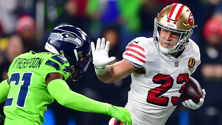 San Francisco 49ers running back Christian McCaffrey (23) versus Seattle Seahawks cornerback Devon Witherspoon (21)