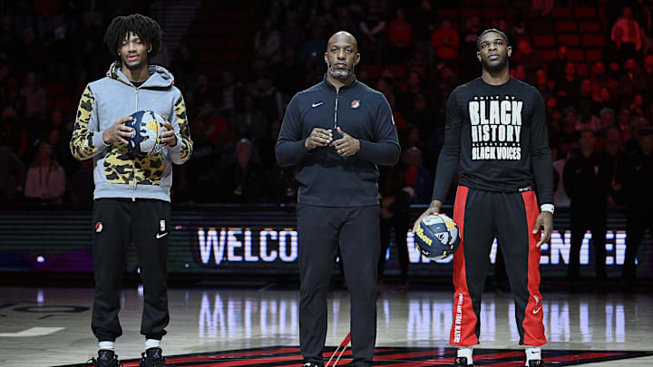 Feb 15, 2024; Portland, Oregon, USA; From left, Portland Trail Blazers guard Shaedon Sharpe (17), head coach Chauncey Billups, and guard Scoot Henderson (00) are recognized for being selected to take part int the NBA All-Star weekend break before a game against the Minnesota Timberwolves at Moda Center. Mandatory Credit: Troy Wayrynen-Imagn Images