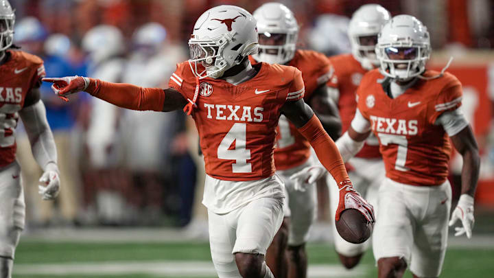 Texas Longhorns defensive back Andrew Mukuba (4) celebrates a interception against Kentucky Wildcats late in the fourth quarter in a NCAA college football game at Darrell K Royal Texas Memorial Stadium, Austin, Texas, Saturday, Nov 24, 2024. Texas Longhorns defensive back Andrew Mukuba (4) celebrates a interception against Kentucky Wildcats late in the fourth quarter in a NCAA college football game at Darrell K Royal Texas Memorial Stadium, Austin, Texas, Saturday, Nov 24, 2024.