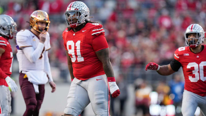 Nov 18, 2023; Columbus, Ohio, USA; Ohio State Buckeyes defensive tackle Tyleik Williams (91) celebrates a tackle during the NCAA football game against the Minnesota Golden Gophers at Ohio Stadium.