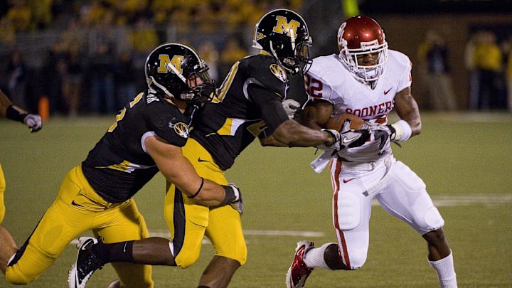 Oct 23, 2010; Columbia, MO, USA; Oklahoma Sooners running back Roy Finch (22) rushes for a first down against the Missouri Tigers during the first half at Faurot Field at Memorial Stadium. Mandatory Credit: Photo by Scott Rovak-Imagn Images