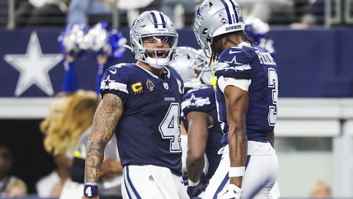 Dallas Cowboys quarterback Dak Prescott celebrates with wide receiver George Pickens following a touchdown.