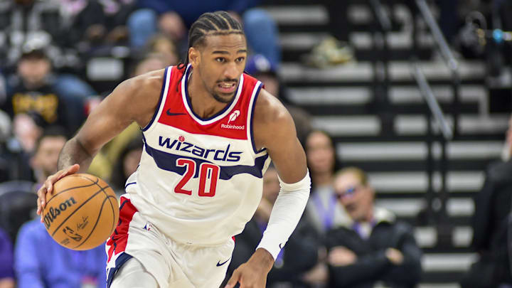Mar 19, 2025; Salt Lake City, Utah, USA;  Washington Wizards center Alex Sarr (20) make a breakaway against the Utah Jazz during the first half at the Delta Center. Mandatory Credit: Peter Creveling-Imagn Images