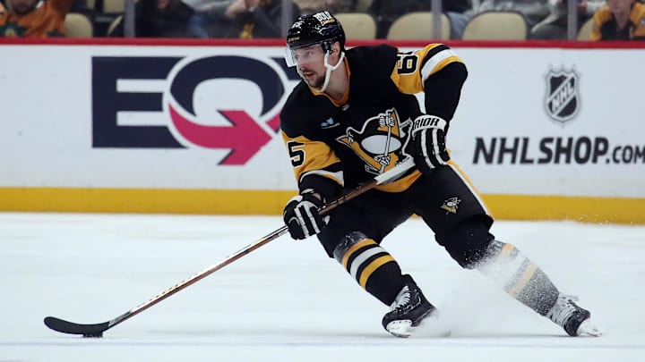 Jan 11, 2025; Pittsburgh, Pennsylvania, USA;  Pittsburgh Penguins defenseman Erik Karlsson (65) skates with the puck against the Ottawa Senators during the third period at PPG Paints Arena. Mandatory Credit: Charles LeClaire-Imagn Images