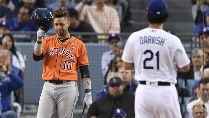 Nov 1, 2017; Los Angeles, CA, USA; Houston Astros first baseman Yuli Gurriel (10) at bat against Los Angeles Dodgers starting pitcher Yu Darvish (21) in the first inning in game seven of the 2017 World Series at Dodger Stadium. Mandatory Credit: Robert Hanashiro-Imagn Images