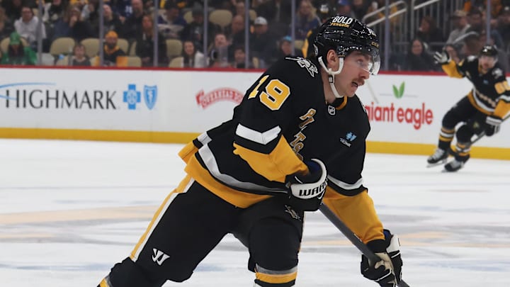 Mar 11, 2025; Pittsburgh, Pennsylvania, USA;  Pittsburgh Penguins center Connor Dewar (19) shoots the puck against the Vegas Golden Knights during the third period at PPG Paints Arena. Mandatory Credit: Charles LeClaire-Imagn Images