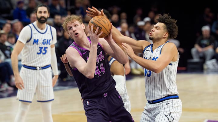 Mar 7, 2026; Minneapolis, Minnesota, USA; Minnesota Timberwolves center Rocco Zikarsky (44) looks to shoot as Orlando Magic forward Noah Penda (93) defends in the fourth quarter at Target Center. Mandatory Credit: Matt Blewett-Imagn Images