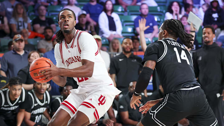 Indiana Hoosiers forward Mackenzie Mgbako (21) looks to shoot over Providence Friars guard Corey Floyd Jr. (14) during the first half at Imperial Arena at the Atlantis resort.