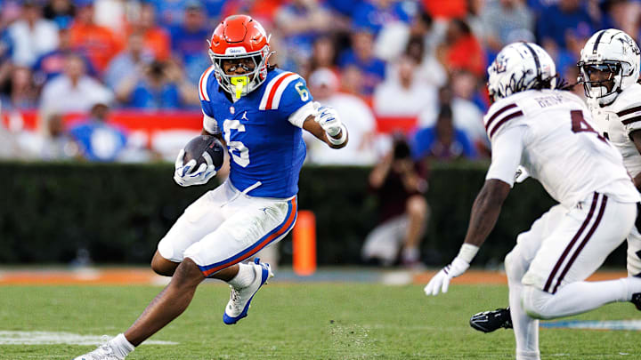 Oct 18, 2025; Gainesville, Florida, USA; Florida Gators wide receiver Dallas Wilson (6) runs with the ball towards Mississippi State Bulldogs cornerback Deago Brumfield (4) during the second half at Ben Hill Griffin Stadium. Mandatory Credit: Matt Pendleton-Imagn Images Oct 18, 2025; Gainesville, Florida, USA; Florida Gators wide receiver Dallas Wilson (6) runs with the ball towards Mississippi State Bulldogs cornerback Deago Brumfield (4) during the second half at Ben Hill Griffin Stadium. Mandatory Credit: Matt Pendleton-Imagn Images