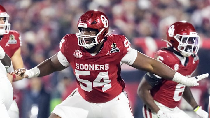 Dec 19, 2025; Norman, OK, USA; Oklahoma Sooners offensive lineman Febechi Nwaiwu (54) against the Alabama Crimson Tide during the CFP National Playoff First Round at Gaylord Family Oklahoma Memorial Stadium. Mandatory Credit: Mark J. Rebilas-Imagn Images