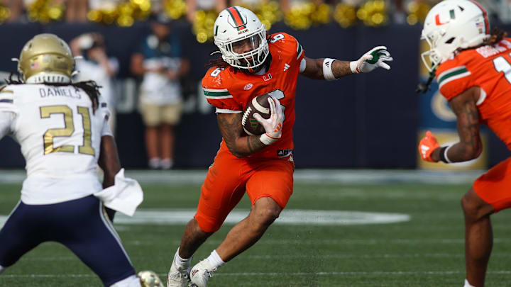 Nov 9, 2024; Atlanta, Georgia, USA; Miami Hurricanes running back Damien Martinez (6) runs the ball against the Georgia Tech Yellow Jackets in the fourth quarter at Bobby Dodd Stadium at Hyundai Field. 