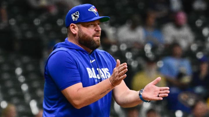 Apr 15, 2026; Milwaukee, Wisconsin, USA; Toronto Blue Jays manager John Schneider makes a pitching change in the seventh inning against the Milwaukee Brewers at American Family Field. 