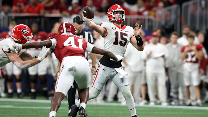 Dec 2, 2023; Atlanta, GA, USA; Georgia Bulldogs quarterback Carson Beck (15) throws a pass in the second quarter against the Alabama Crimson Tide at Mercedes-Benz Stadium. Mandatory Credit: Brett Davis-Imagn Images