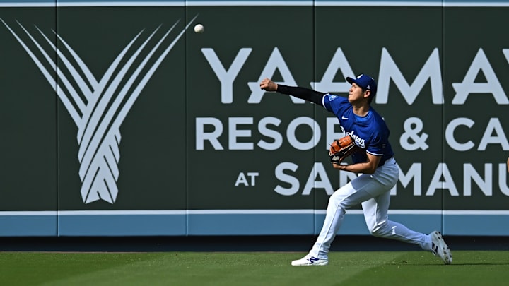 Mar 29, 2025; Los Angeles, California, USA; Los Angeles Dodgers designated hitter Shohei Ohtani (17) warms up before a game against the Detroit Tigers at Dodger Stadium. Mandatory Credit: Jonathan Hui-Imagn Images