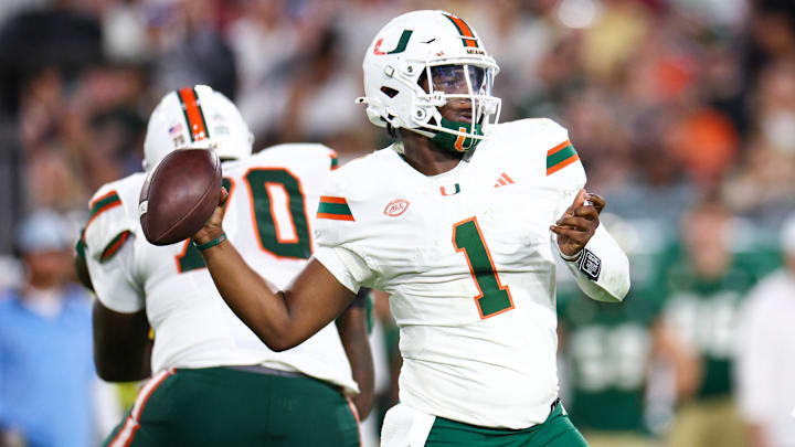 Sep 21, 2024; Tampa, Florida, USA; Miami Hurricanes quarterback Cam Ward (1) throws a pass against the South Florida Bulls in the third quarter at Raymond James Stadium. Mandatory Credit: Nathan Ray Seebeck-Imagn Images Sep 21, 2024; Tampa, Florida, USA; Miami Hurricanes quarterback Cam Ward (1) throws a pass against the South Florida Bulls in the third quarter at Raymond James Stadium. Mandatory Credit: Nathan Ray Seebeck-Imagn Images