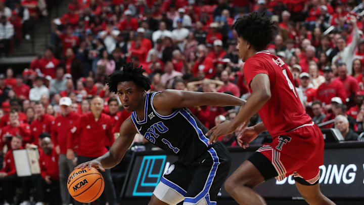 Jan 17, 2026; Lubbock, Texas, USA;  BYU Cougars guard Robert Wright III (1) works the ball around Texas Tech Red Raiders guard Christian Anderson (4) in the second half at United Supermarkets Arena. Mandatory Credit: Michael C. Johnson-Imagn Images