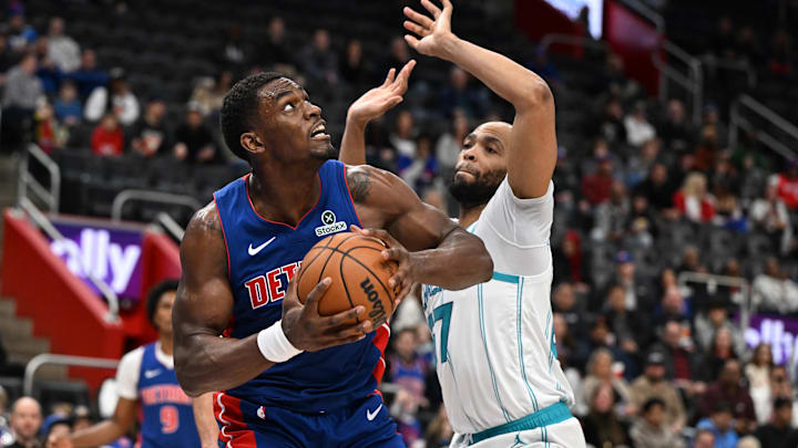 Feb 9, 2025; Detroit, Michigan, USA;  Detroit Pistons center Jalen Duren (0) tries to score on Charlotte Hornets forward Taj Gibson (67) in the second quarter at Little Caesars Arena. Mandatory Credit: Lon Horwedel-Imagn Images