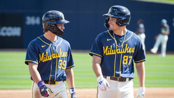 Milwaukee Brewers infield prospects Josh Adamczewski and Brady Ebel walk off the field during spring training workouts Tuesday, February 17, 2026, at American Family Fields of Phoenix in Phoenix, Arizona.
